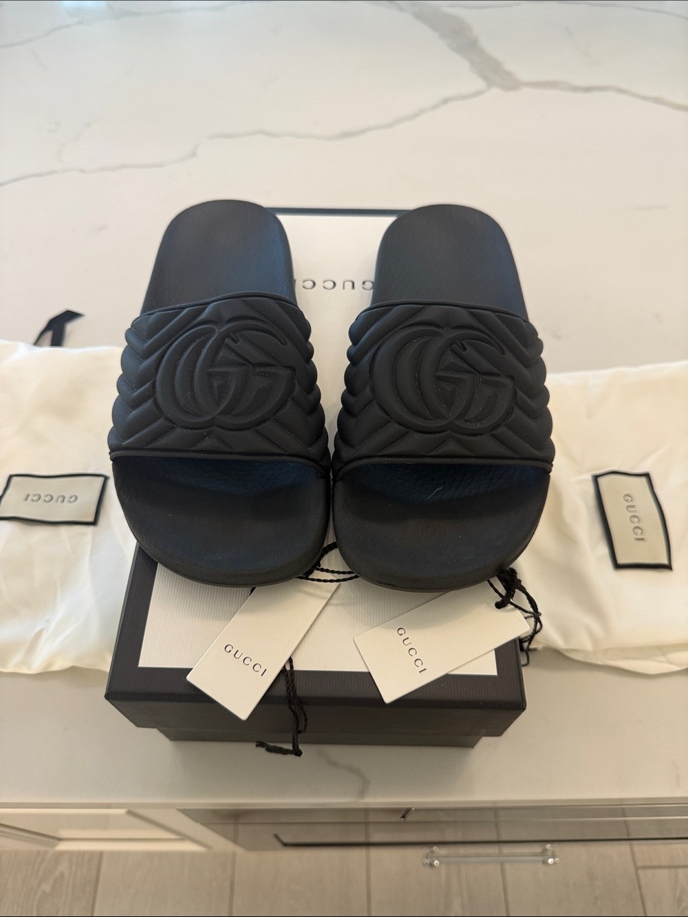 Gucci Black Embossed Logo Slide Sandals